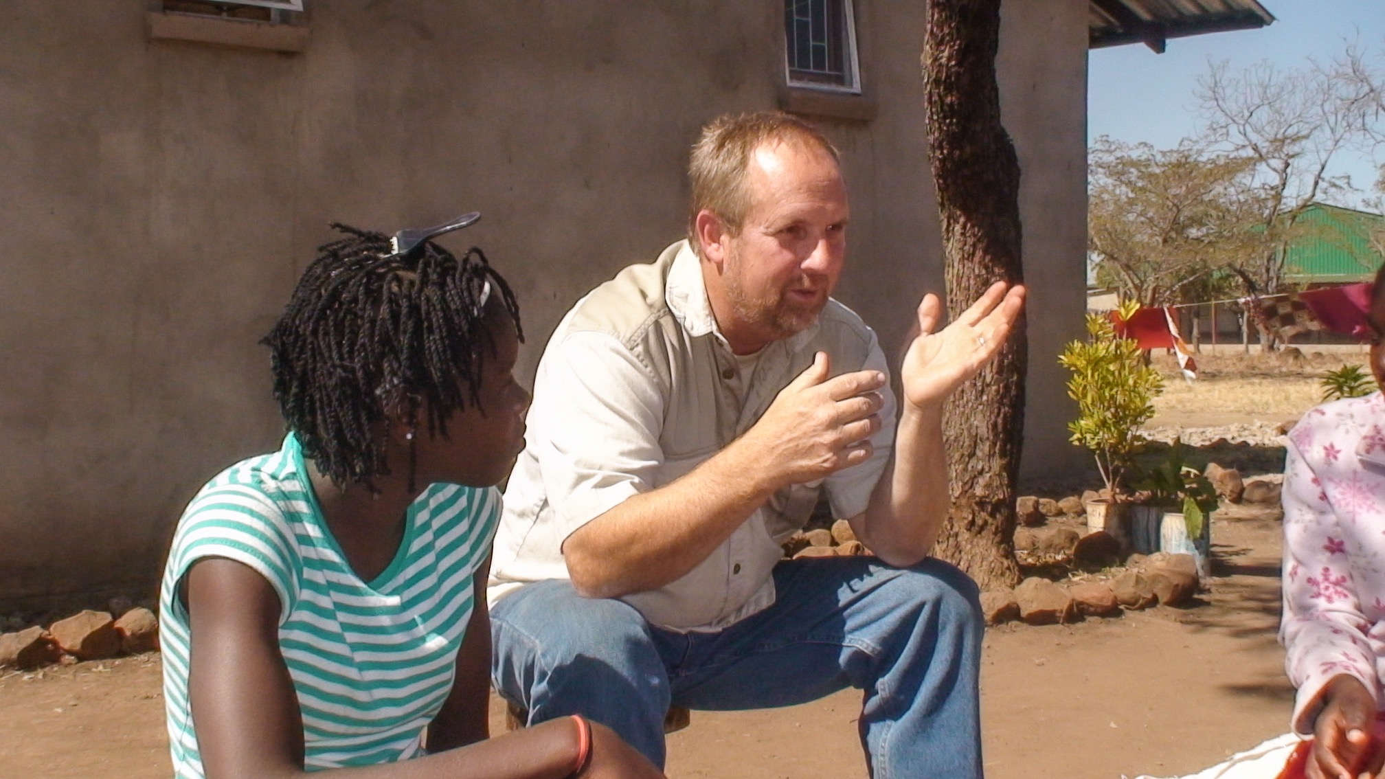 Ken speaking with Zambian women in the earlier years of ministry
